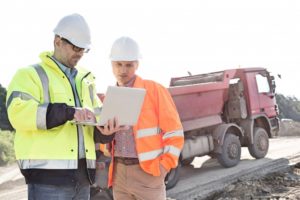 construction workers using laptop