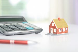calculator and a small house