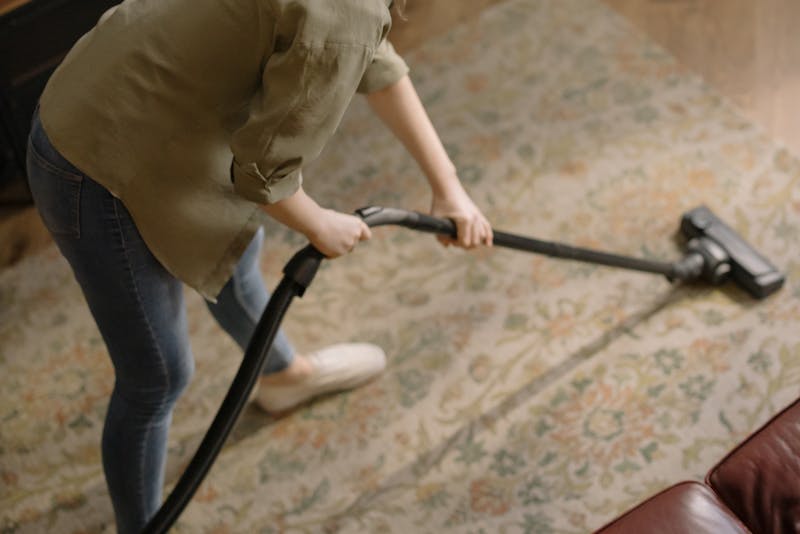 vacuuming the floor