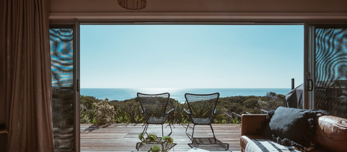 Terrace of modern villa overlooking ocean
