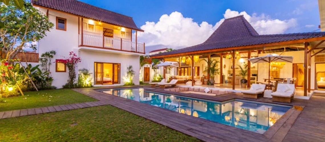 a beautiful outdoor living area with a swimming pool